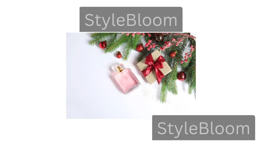 A wrapped gift box with a red bow beside a generic pink perfume bottle and fir branches