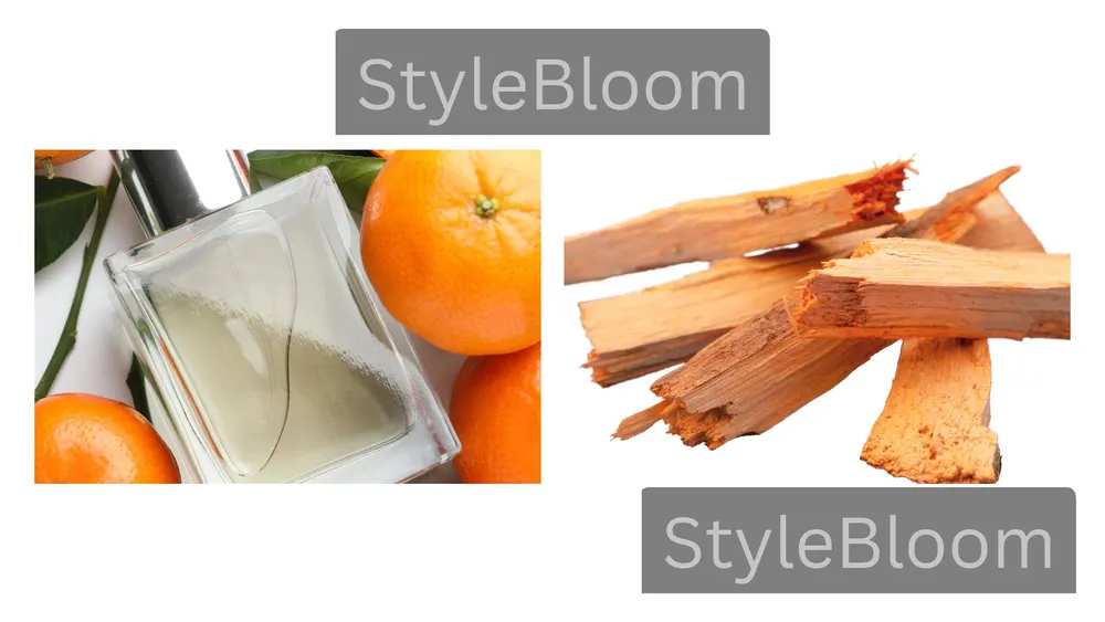 A clear perfume bottle beside oranges, and sandalwood pieces