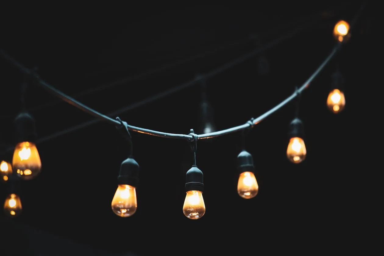 Warm festoon string lights glowing at night — a backyard Christmas gift for Mum in Australia