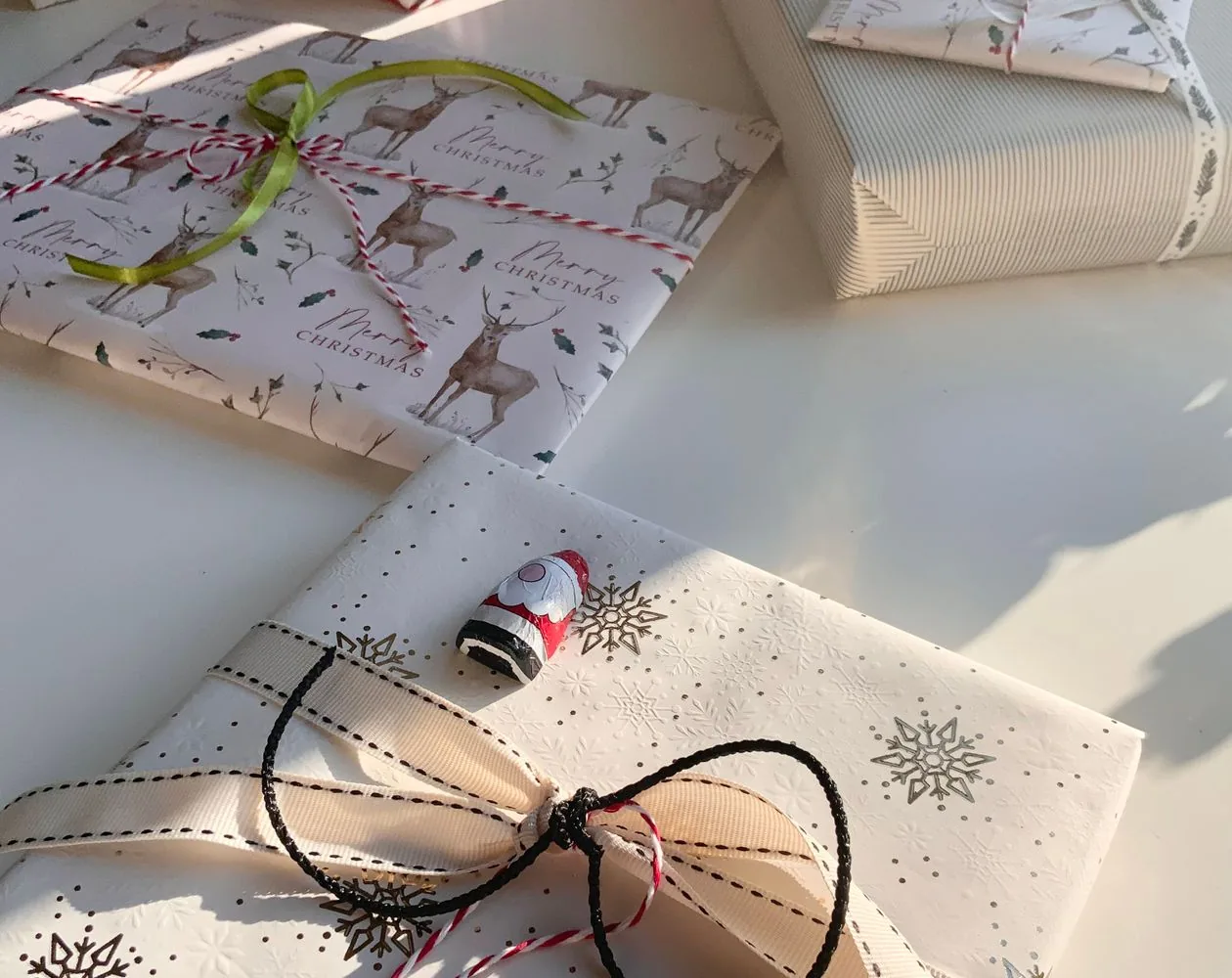 Wrapped Christmas gifts in bright summer sunlight with chocolate Santas — Christmas gift ideas for Mum in Australia