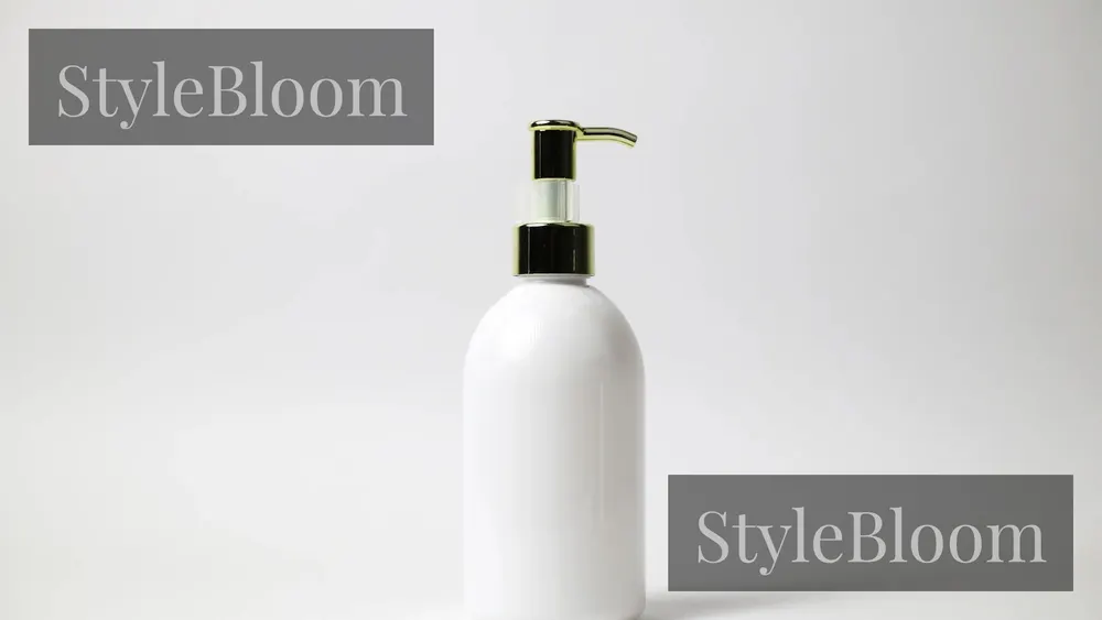 An unlabelled white pump bottle on a plain background