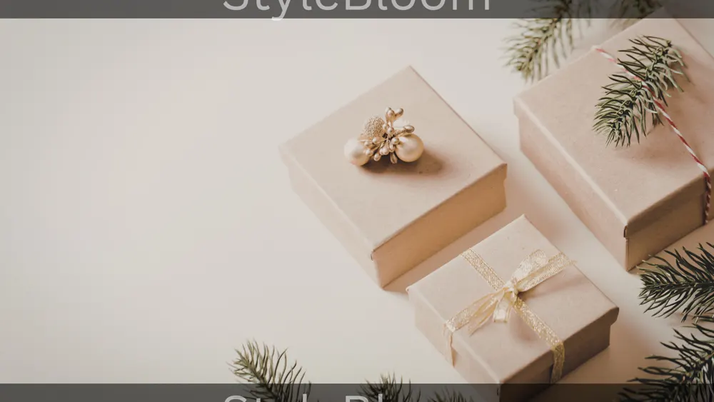 Three kraft-paper gift boxes beside pine branches on a plain light background.