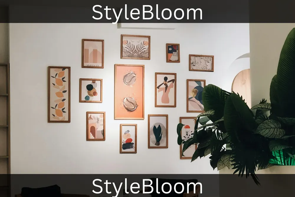 A gallery wall of framed prints above seating, with a large plant beside it