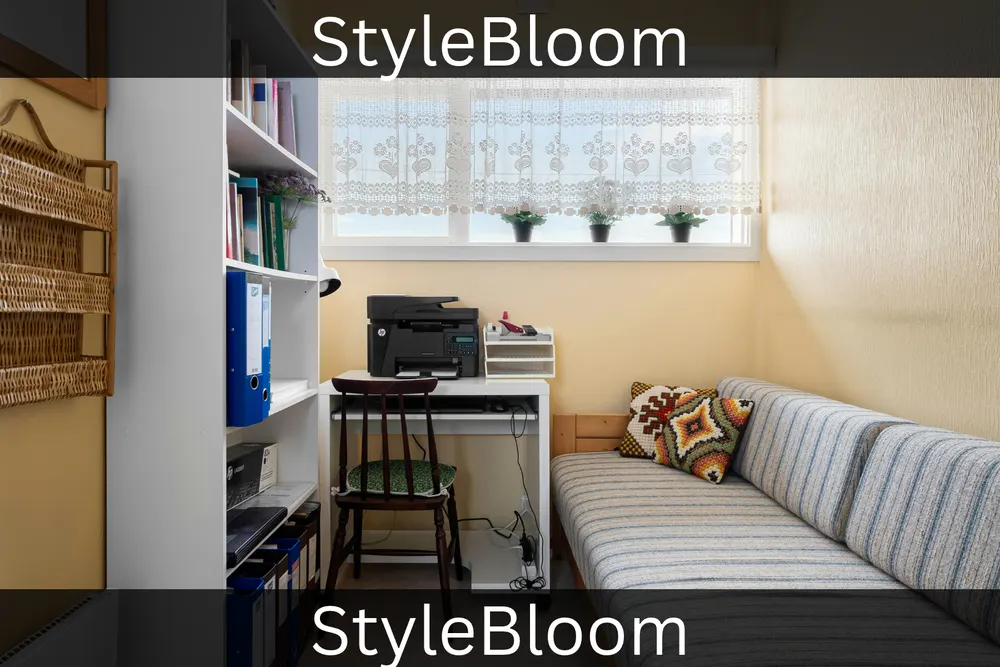 A compact room with a tall bookshelf, a desk under the window, and a striped daybed