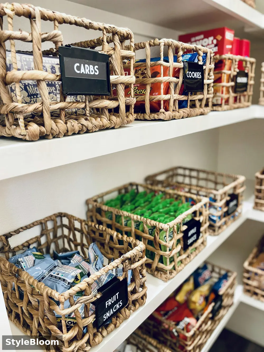 Labeled woven baskets on pantry shelves