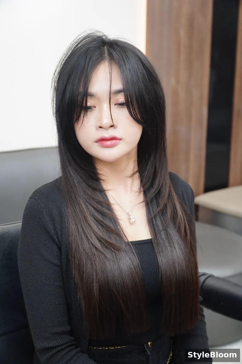 Smooth shiny hair after keratin care, in a salon chair