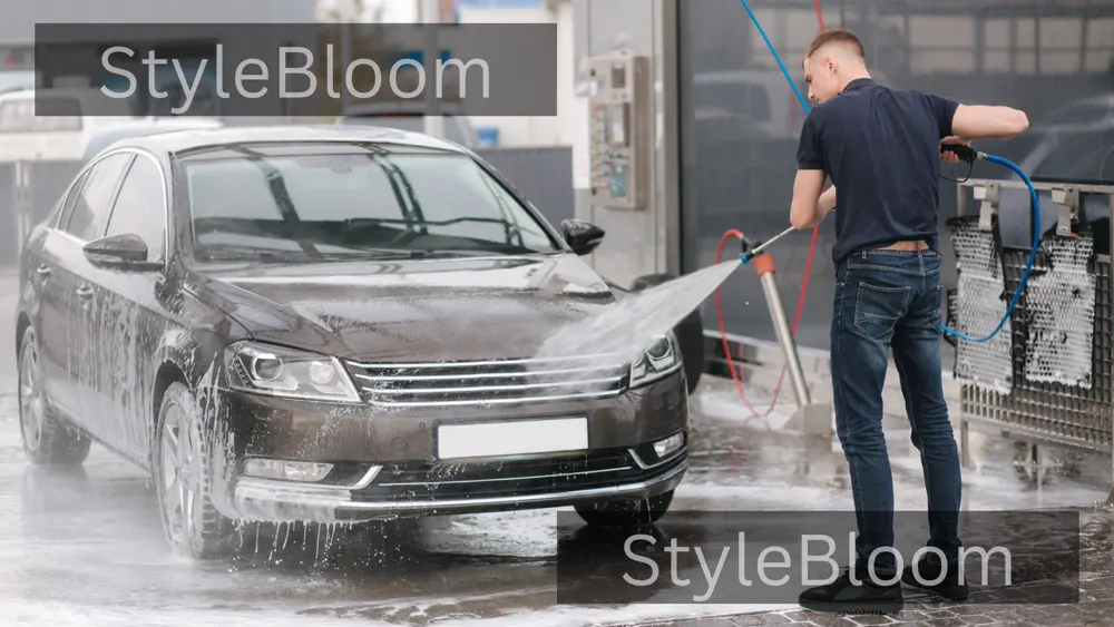 Car wash with a wide fan nozzle and foam — the safe way to wash paint, with distance between nozzle and bodywork clearly visible.