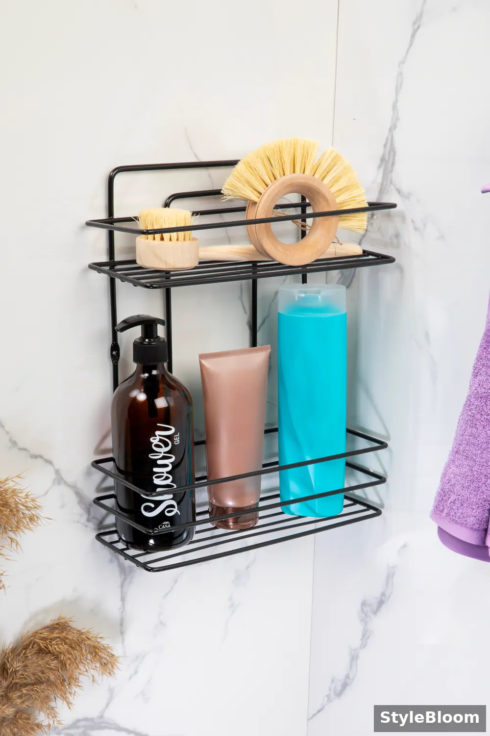 Black two-tier wire wall rack holding shower bottles and wooden brushes